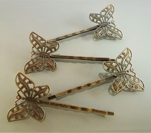 4 barrettes papillons filigrane bronze