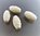 4 perles écrues sculptées forme ovale 15 mm