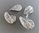 4 perles ovales ondulées 28mm coloris argent