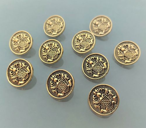 10 boutons blasons 18 mm plastique doré
